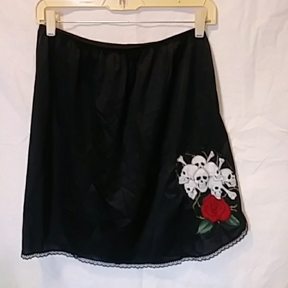 Upcycled black half slip with skull applique